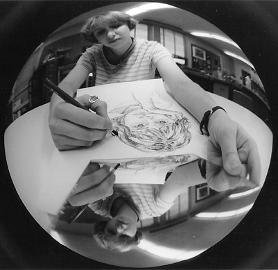 Scanned photograph of a young woman sketching.