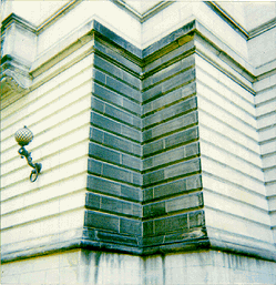 Scanned Polaroid of patch of soot-covered wall.