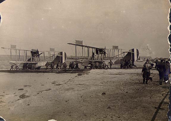 Scanned photo of hydroplanes on beach.