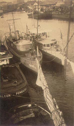 Scanned photo of boats docked.