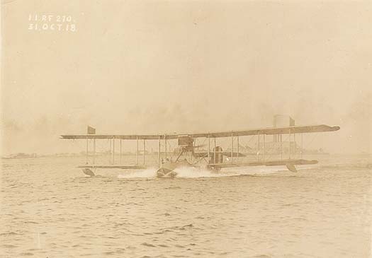 Scanned photo of a hydroplane taxiing.