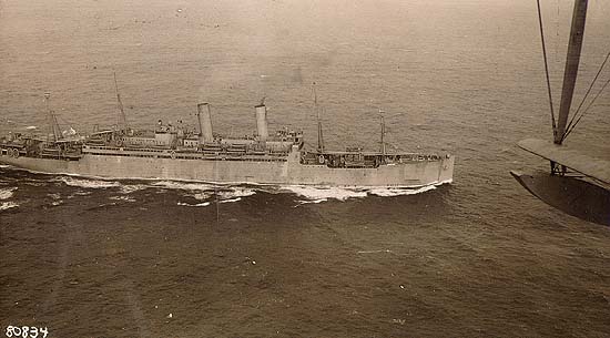 Scanned photo of ship seen from the air.