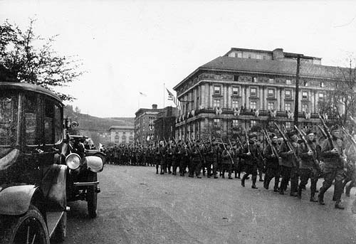 Scanned photo of troops marching past P.A.A.