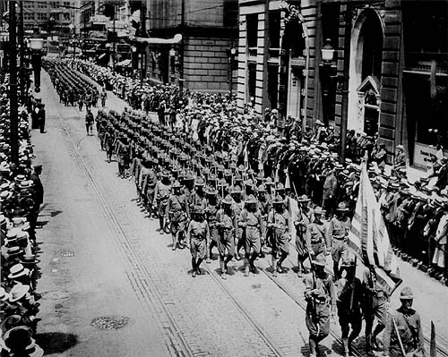 Scanned photo of troops marching up Fifth Avenue.