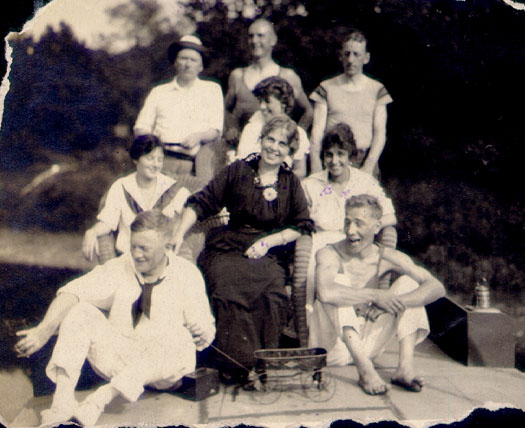 Scanned photo of 9 individuals.