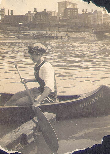 Scanned photo of a young woman canoeing on the Allegheny River.