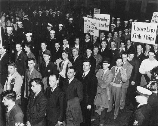 Scanned photo of men in lines.