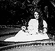 Thumbnail:_Photo_of_lady_seated_upon_lily_pad_(detail).