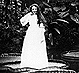 Thumbnail:_Photo_of_lady_standing_upon_lily_pad_(detail).
