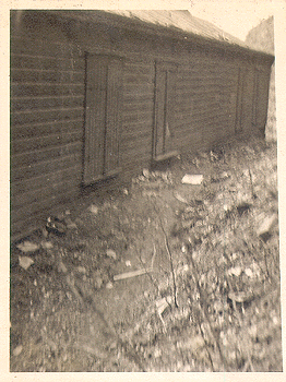 Photograph 
of four bedrooms occupied by four families.