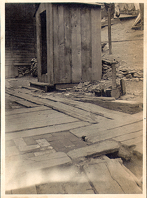 Photograph 
of hydrant adjacent to privy vault.