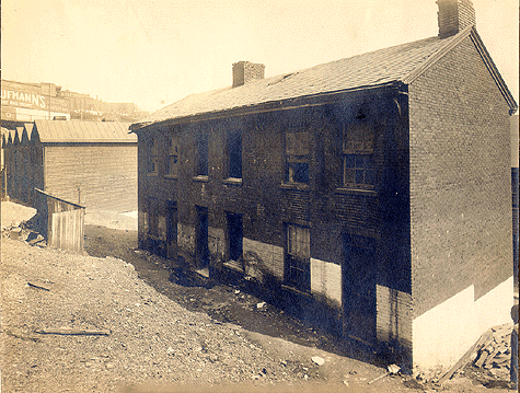 Photograph 
of dilapidated house on Cornet Street.