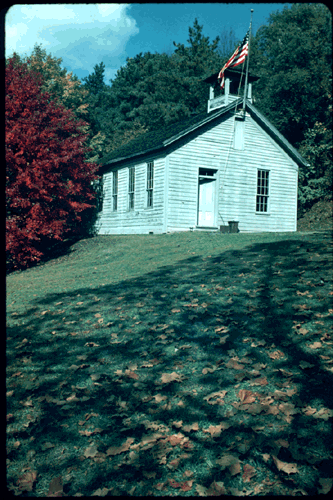 Scanned slide of cabin at Meadowcroft.