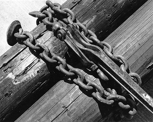 Scanned photo of utility poles on trailer.