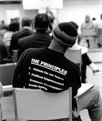 Back view of
t-shirted participant at '96 conference.